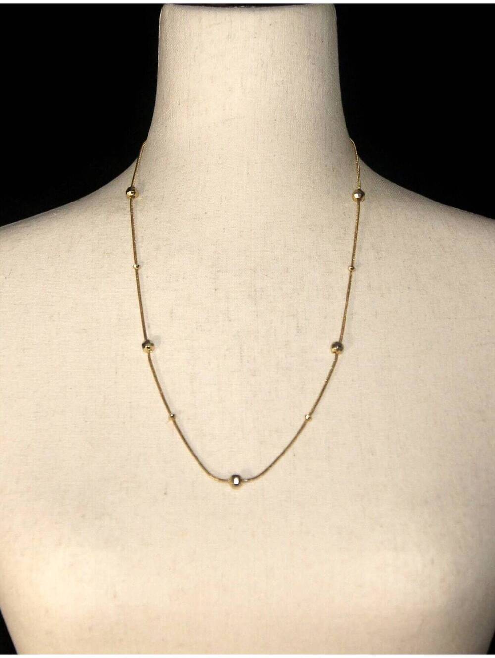 Vintage Gold Tone 24 Inch Necklace with Stationary Gold Tone Beads.